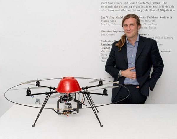 Artist David Cotterell standing with miniature stunt helicopter as part of the film Slipstream