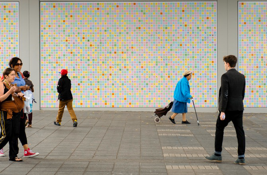 image of the general public walking past Peckham Peace Wall